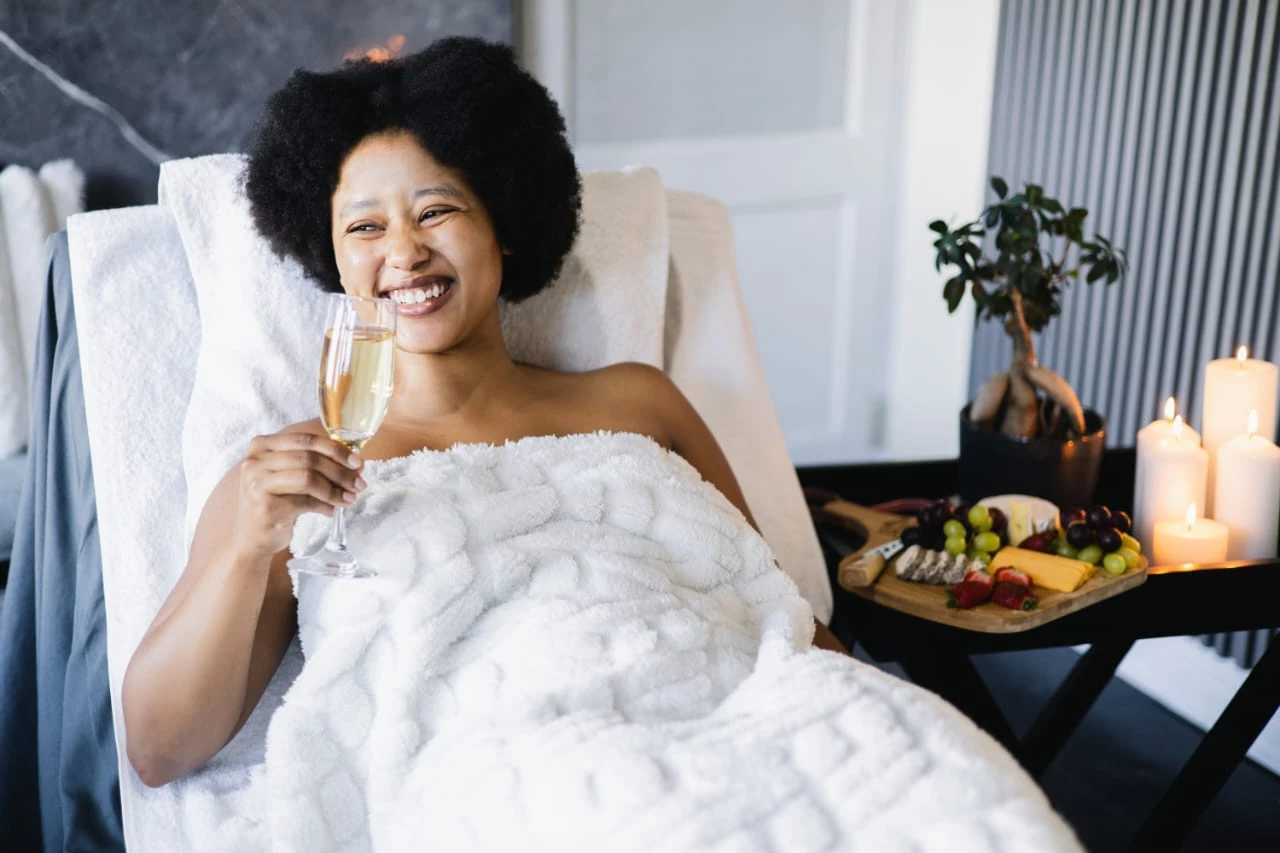 Guest relaxing at Serene Flair Spa with a drink